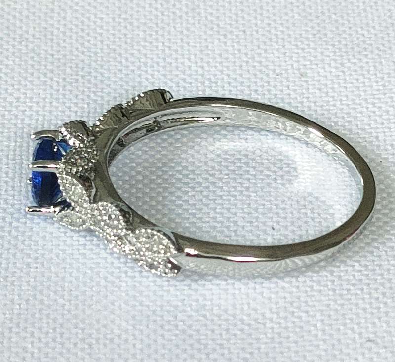 Dress ring -lab created blue and white stones- size US 7