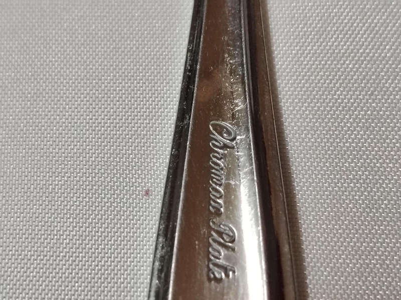 The image displays a set of vintage fish knives, as indicated by their distinctive shape