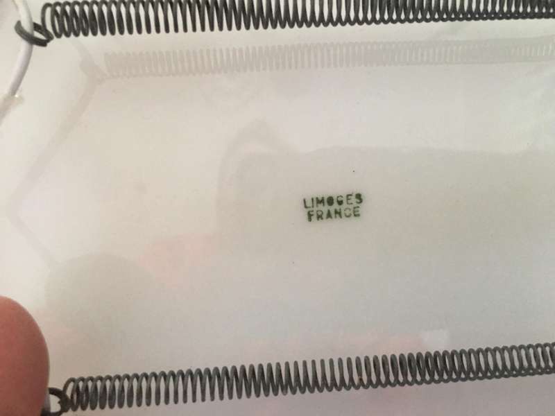 2 LOVELY PLATES - LIMOGES AND DORA PAPIS WITH PLATE HOLDERS
