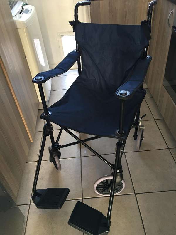 FOLD UP WHEELCHAIR  WITH FREE ACCESSORIES