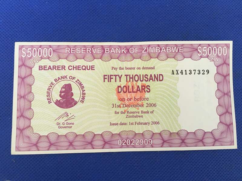 ZIMBABWE FIFTY THOUSAND DOLLARS  BEARER CHEQUE UNC CONDITION 2006 SEREAL NUMBER - AX4137329