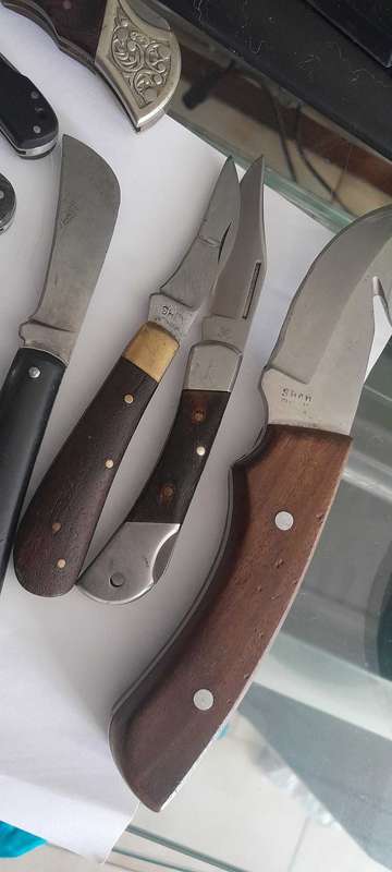 10 Pocket Knives.