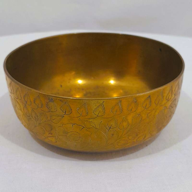 Beautiful and polished brass bowl with leaf and flower engraving