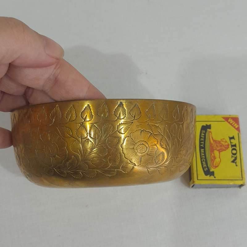 Beautiful and polished brass bowl with leaf and flower engraving