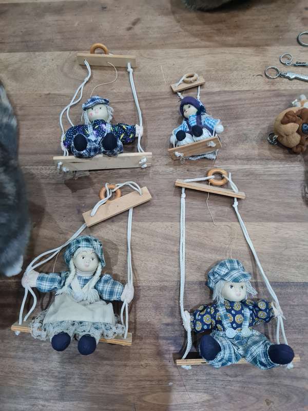 Vintage collectors Porcelain Dolls on wooden swing