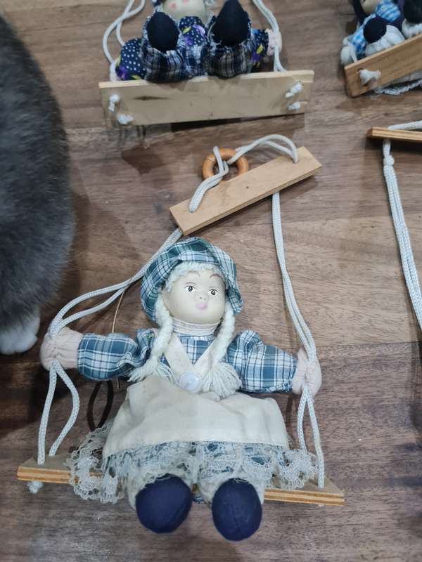 Vintage collectors Porcelain Dolls on wooden swing