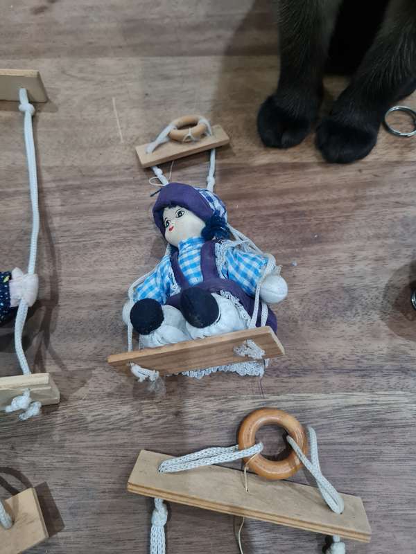 Vintage collectors Porcelain Dolls on wooden swing
