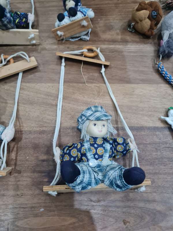 Vintage collectors Porcelain Dolls on wooden swing