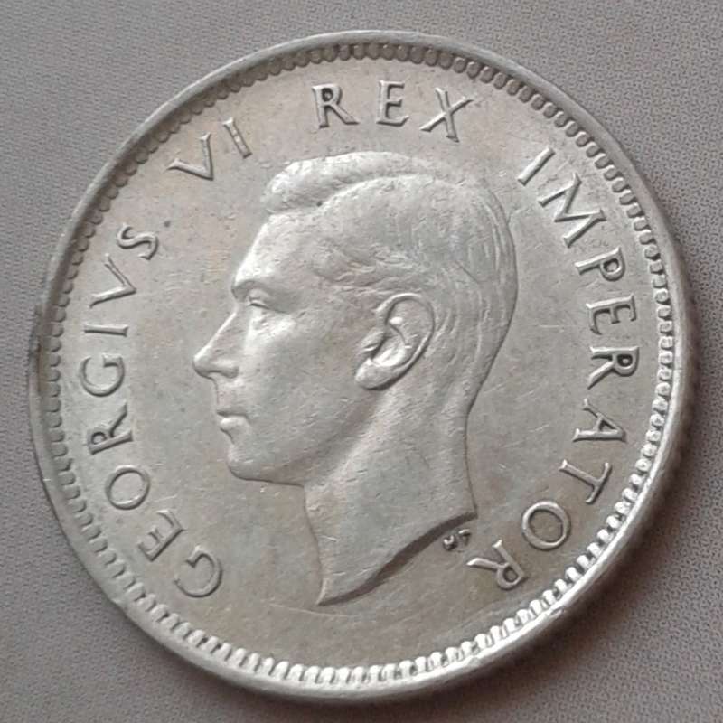 Higher grade 1941 union silver sixpence with reverse die cracks