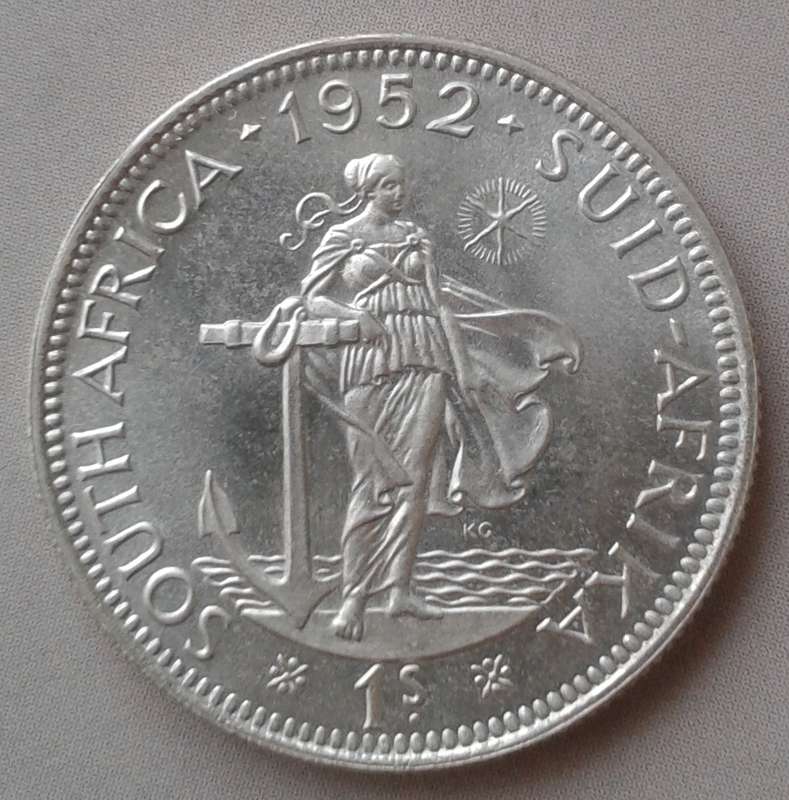1952 Union silver shilling in lustrous proof.
