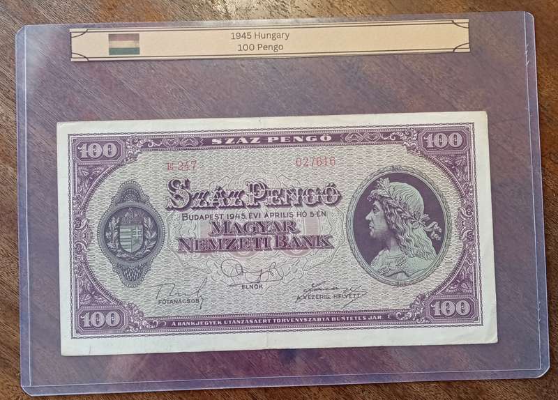 1945 WW2 Hungary 100 Pengő note in hard plastic sleeve