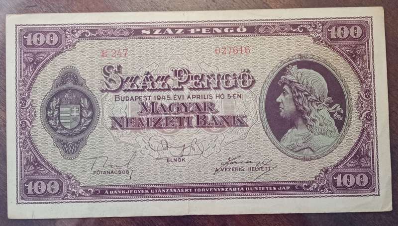 1945 WW2 Hungary 100 Pengő note in hard plastic sleeve