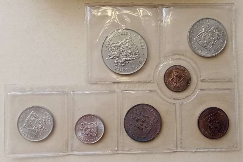Partial 1975 uncirculated Mint pack (50c-1/2c) with scarcer 1/2c