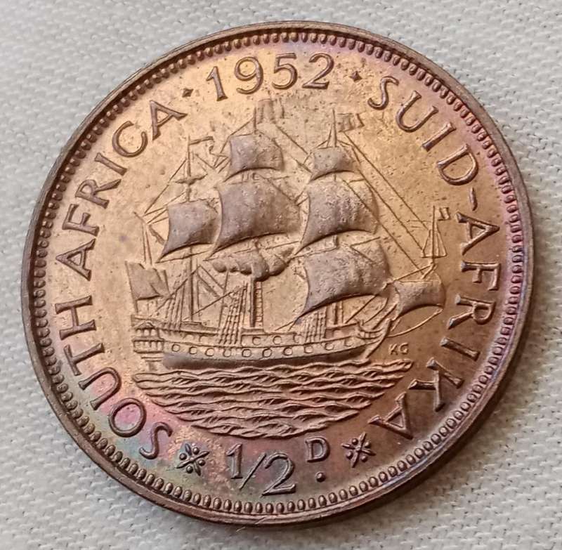 Uncirculated 1952 union 1/2 penny in a capsule