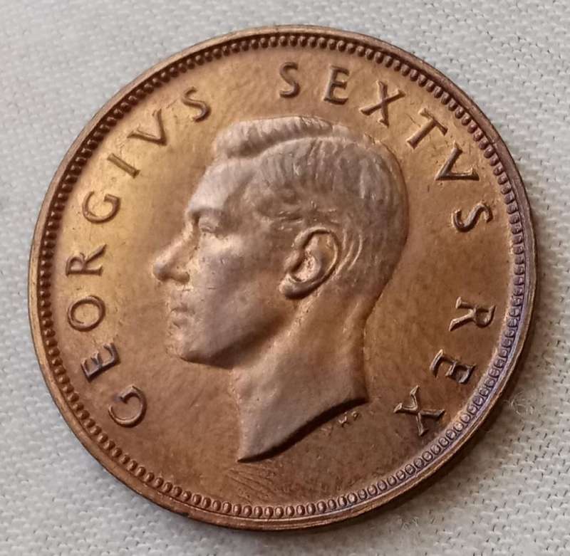 Uncirculated 1952 union 1/2 penny in a capsule