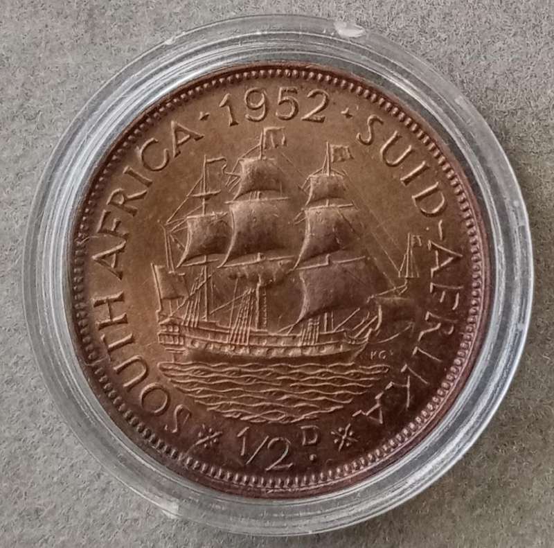 Uncirculated 1952 union 1/2 penny in a capsule