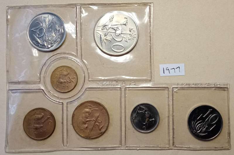 Partial 1977 uncirculated Mint pack (50c-1/2c) with scarcer 1/2c