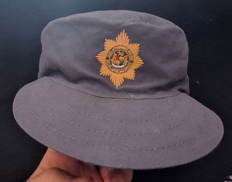 PRE 1994 LAW ENFORCEMENT FLAPCAP - MEASURES 57CM (WORN)
