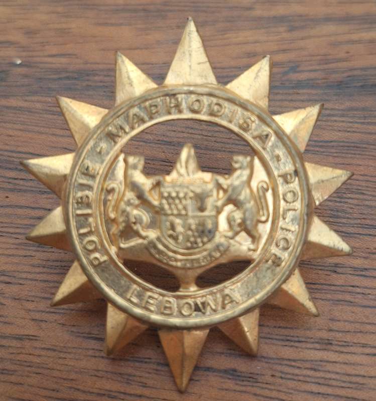 EX HOMELAND - LEBOWA POLICE GILDING CAP BADGE - SCREWS INTACT