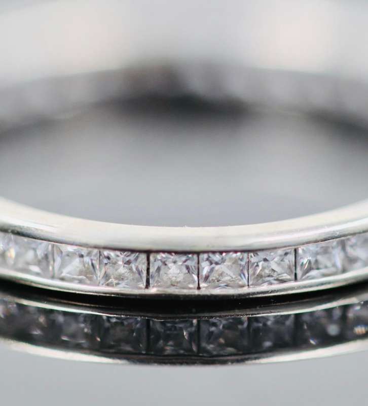 9ct  WHITE GOLD CHANNEL SET CUBIC ZIRCONIA ETERNITY RING. LONDON, ENGLAND HALLMARKED
