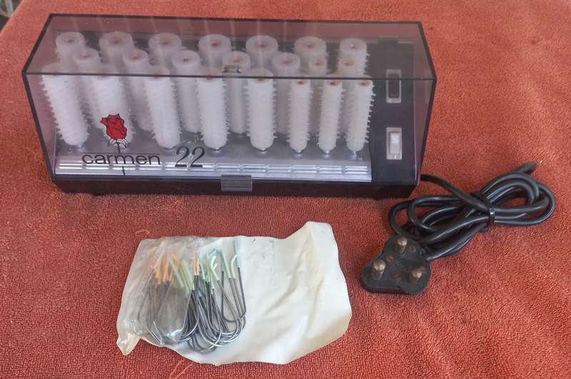 Lot of warm curlers (Carmen 22), hair dye, electric water bottle, heath balls, & jewelry box