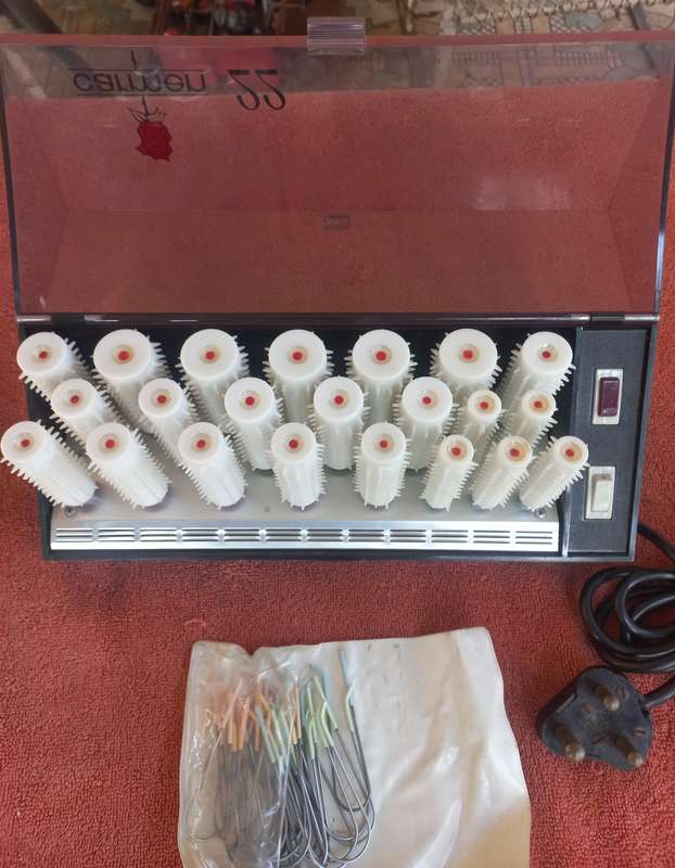 Lot of warm curlers (Carmen 22), hair dye, electric water bottle, heath balls, & jewelry box