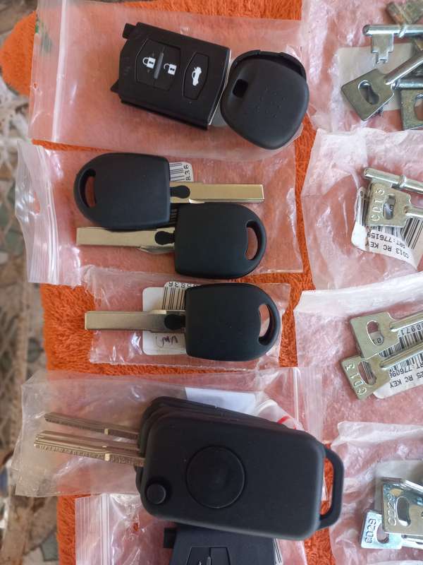 Lot of key-blanks and car key-remote covers - see photos and description