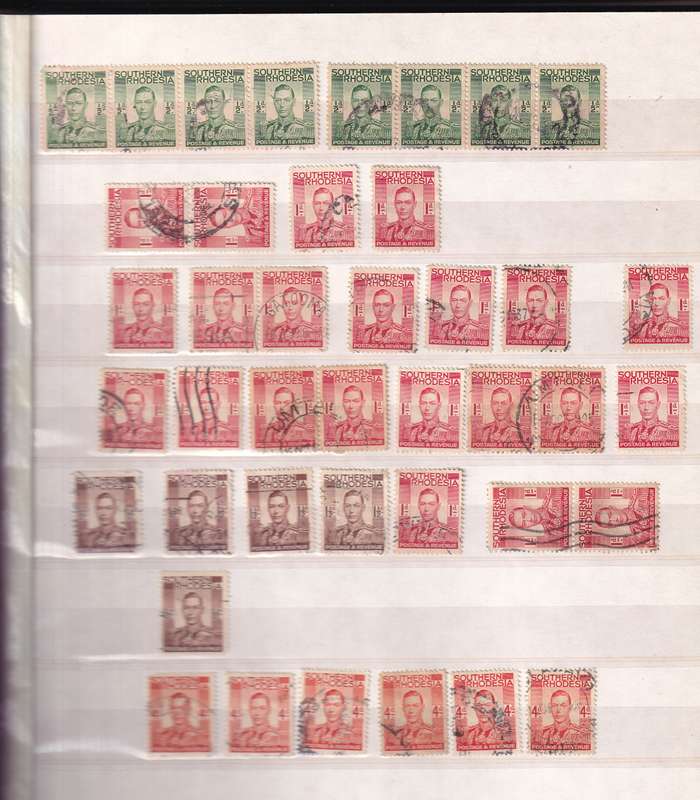 Pronto 32 page stamp album with some Southern Rhodesia stamps , good used condition
