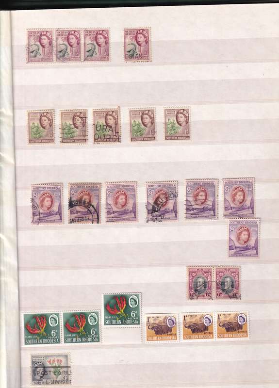 Pronto 32 page stamp album with some Southern Rhodesia stamps , good used condition