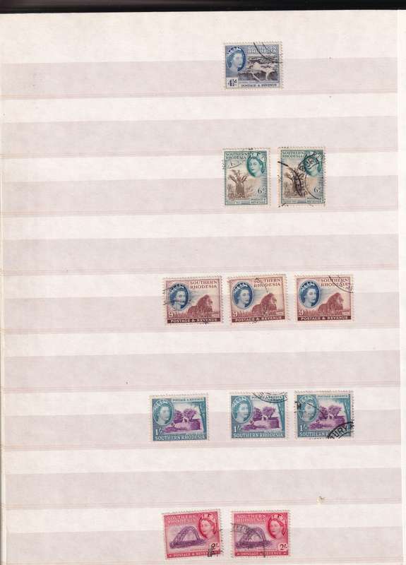 Pronto 32 page stamp album with some Southern Rhodesia stamps , good used condition