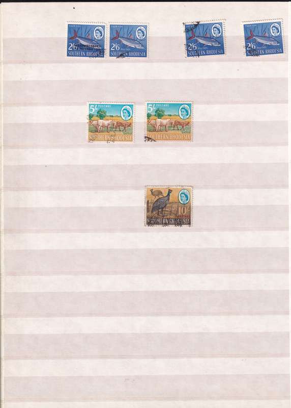 Pronto 32 page stamp album with some Southern Rhodesia stamps , good used condition