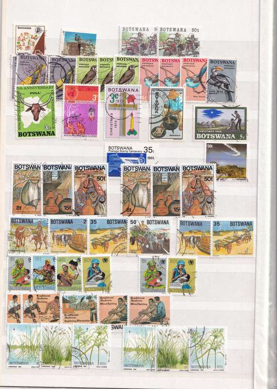 Stamp Album green 16 pages (32 sides) in good used condition filled with used stamps