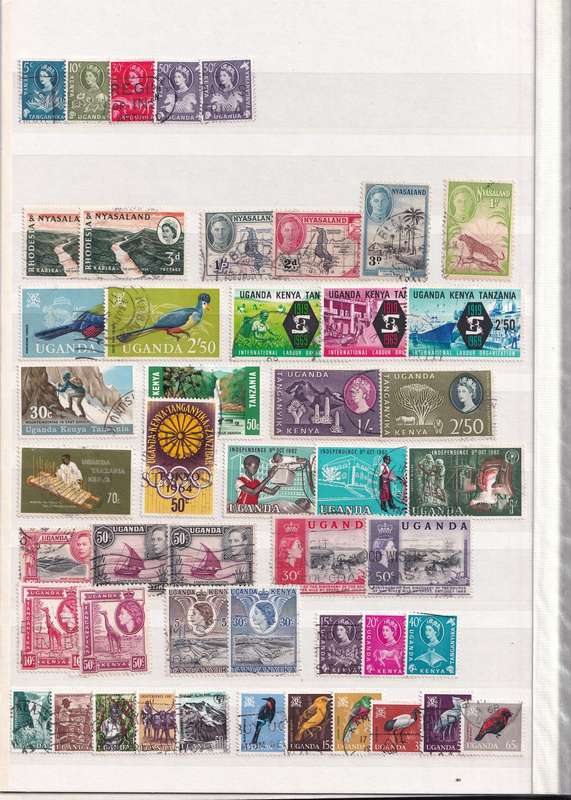 Stamp Album green 16 pages (32 sides) in good used condition filled with used stamps