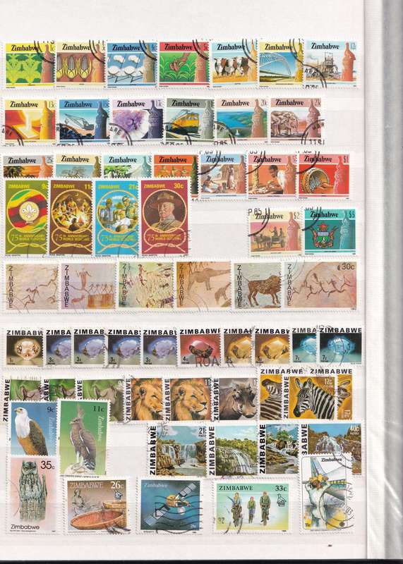 Stamp Album green 16 pages (32 sides) in good used condition filled with used stamps