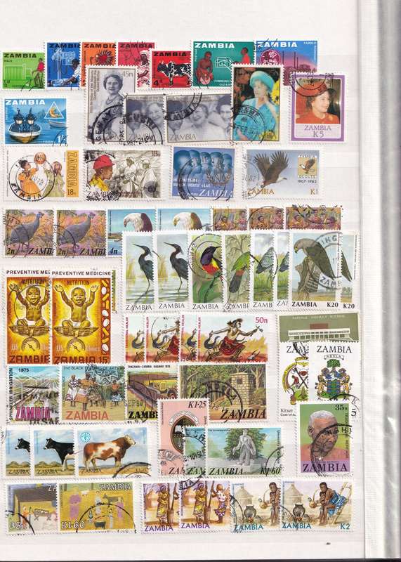Stamp Album green 16 pages (32 sides) in good used condition filled with used stamps