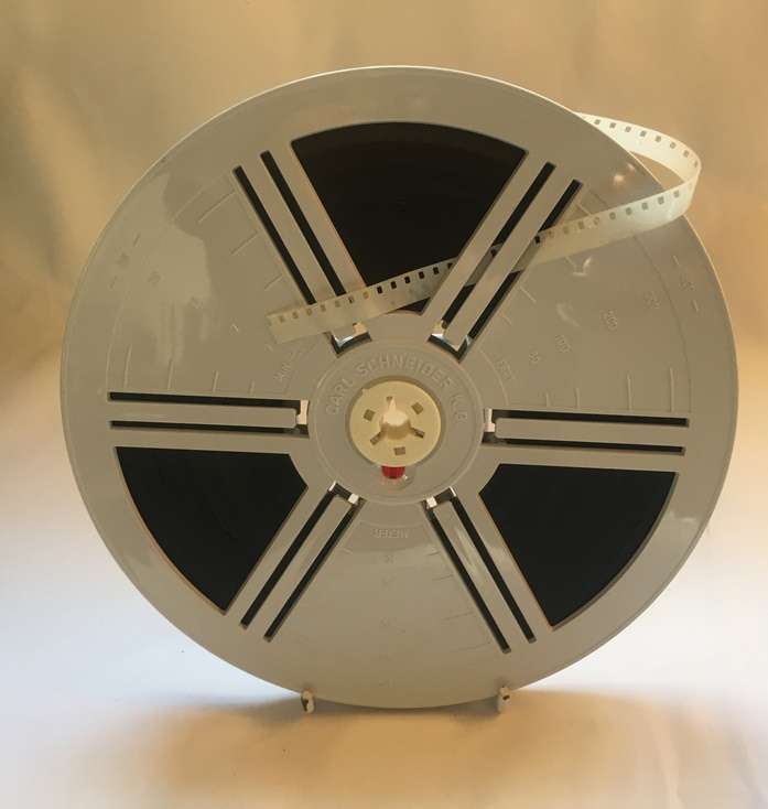 8 mm. CARL SCHNEIDER 180 mm. / 7 ins.  FILM REEL , IN CLEAR CRYSTAL DUST CASE