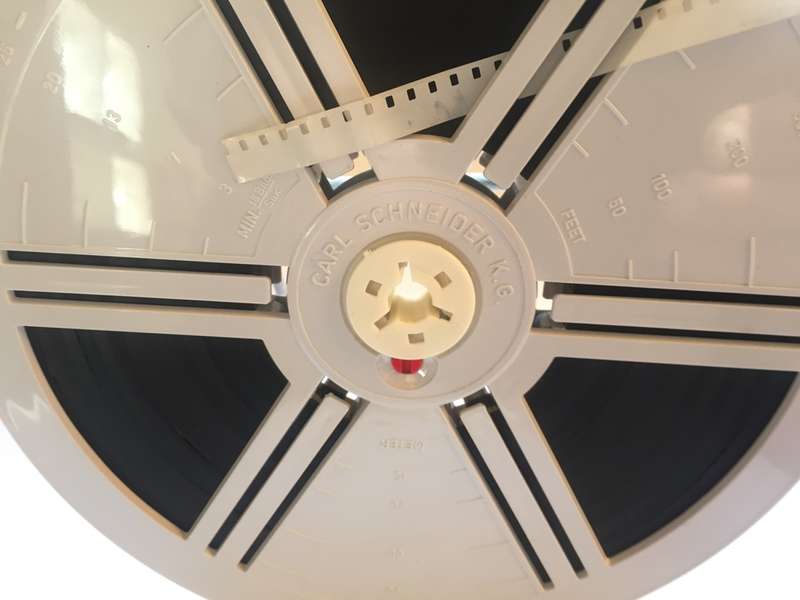 8 mm. CARL SCHNEIDER 180 mm. / 7 ins.  FILM REEL , IN CLEAR CRYSTAL DUST CASE