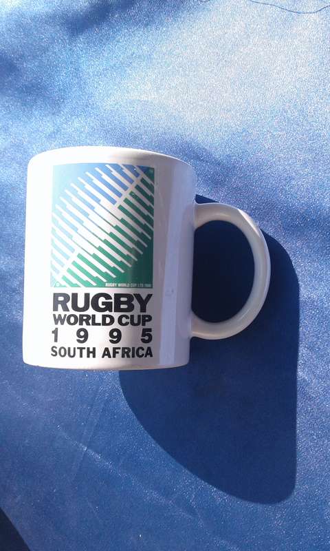 Rugby joblot.  1995 mascot, ties and ashtray.  Rugby ball, 320mm long, needs to be pumped.