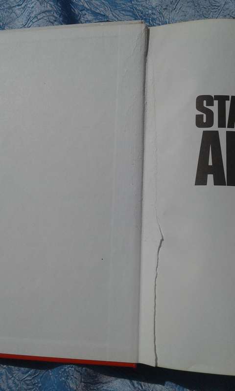 "Staying Alive"  Ron Reid-Daly.  Hard cover.