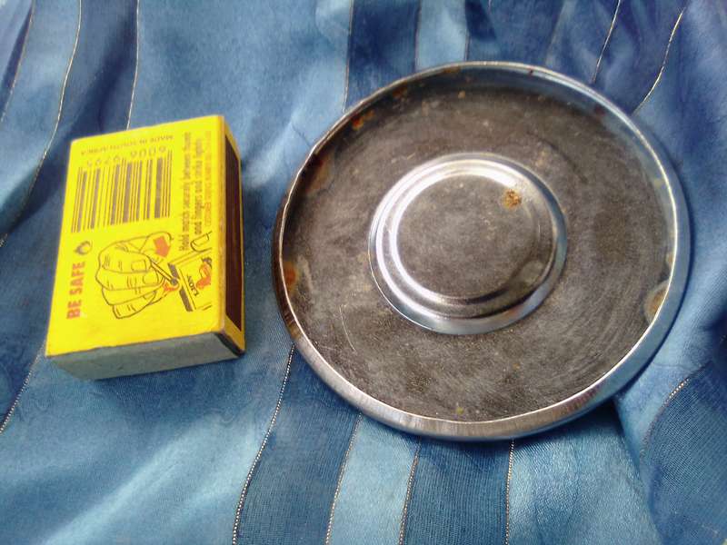 Small, MG automobile, metal disc.