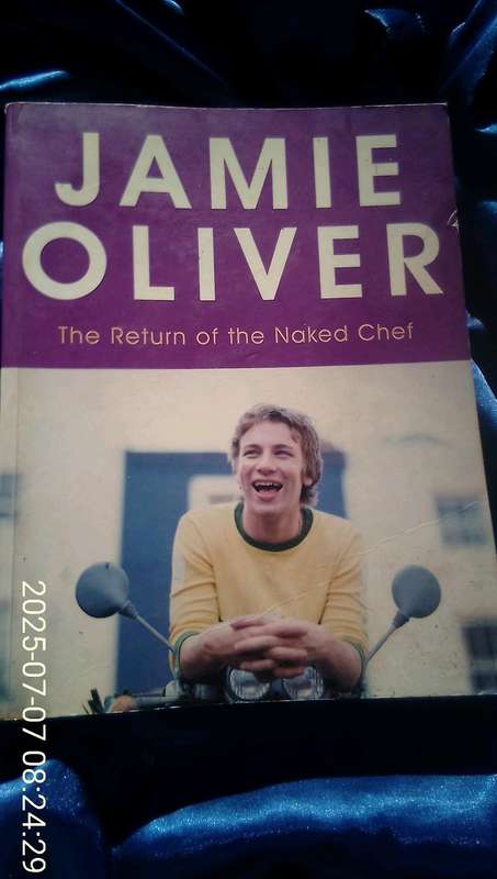 "The Return of the Naked Chef'  Jamie Oliver.  Soft cover