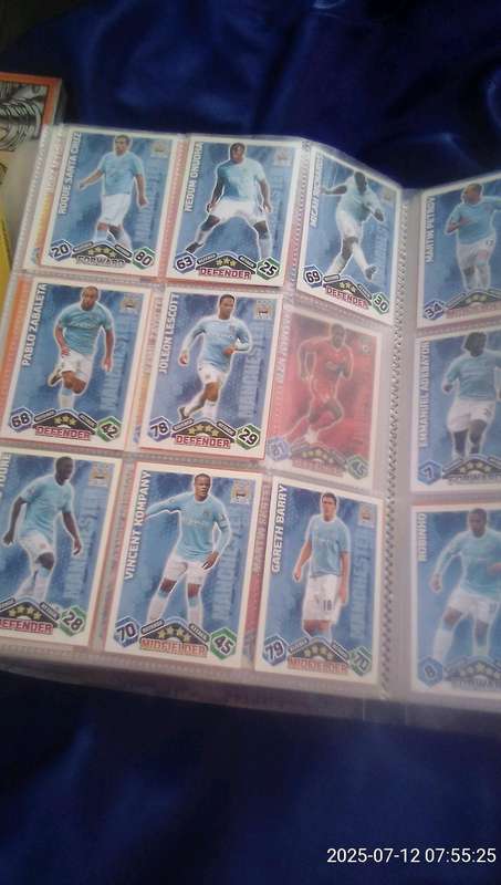A file containing over 200 Topps Match Attack soccer cards.