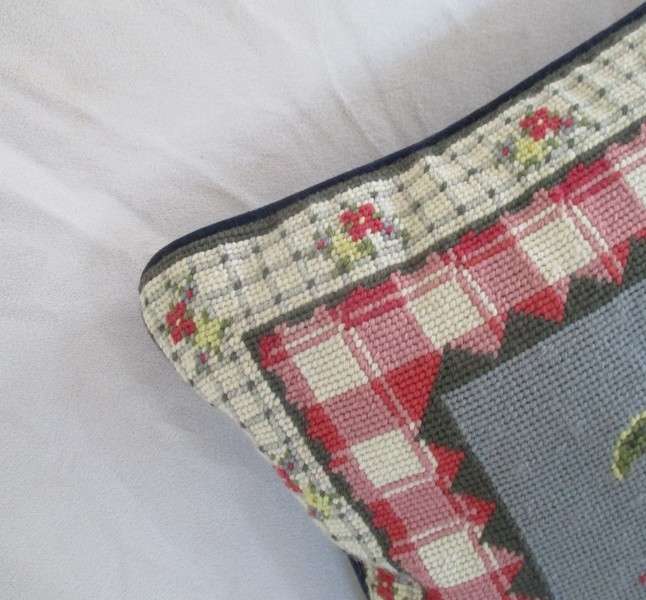 A cute Rug Barn "Needlepoint by hand" tapestry cushion