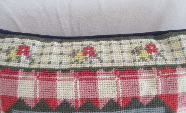 A cute Rug Barn "Needlepoint by hand" tapestry cushion