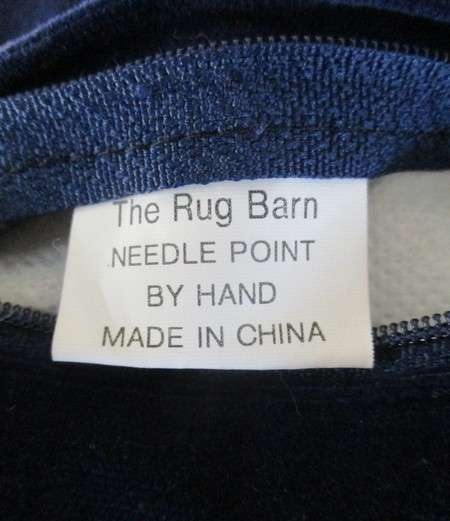 A cute Rug Barn "Needlepoint by hand" tapestry cushion