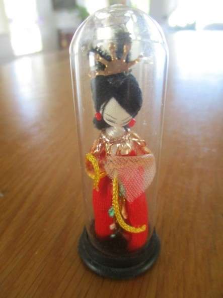 Batch of eight small collectable toys  including Russian and Chinese dolls and Wade Disney dog Tramp