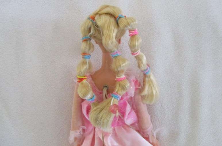 Vintage 1990's Barbie with pull-string length altering hair - knees bend