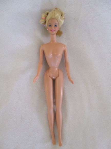 Vintage 1990's Barbie with pull-string length altering hair - knees bend