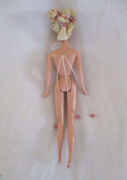Vintage 1990's Barbie with pull-string length altering hair - knees bend