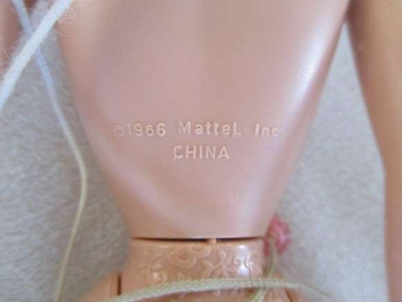 Vintage 1990's Barbie with pull-string length altering hair - knees bend